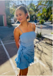 Photo of Addie Hobbes in a blue dress. 