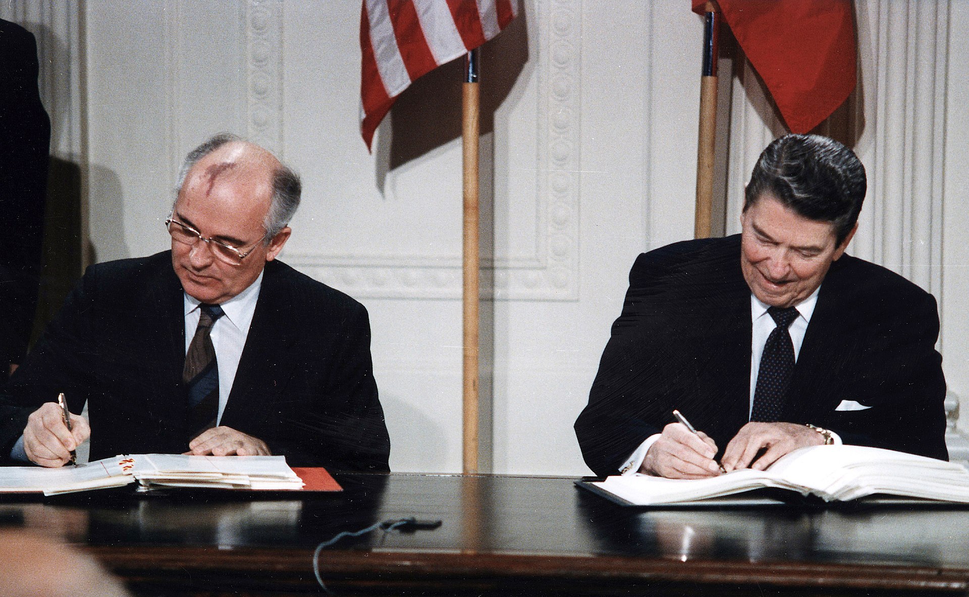 Photo of Gorbachev and Reagan signing the INF Treaty.